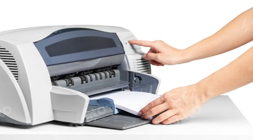 Preview: Printer operation with a hand pressing a button for document printing in an office setup