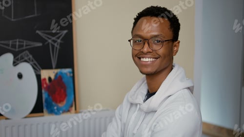 Preview: Portrait of young man attending art class lesson with teacher