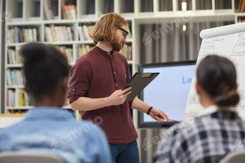 Preview: Young businessman holding the presentation