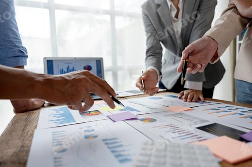 Preview: Teams of business people work together in office meeting room to plan activities using graphs and ch