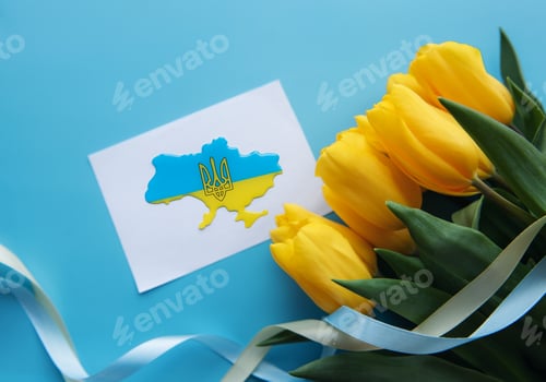 Preview: Сard with a map of Ukraine in the colors of the Ukrainian flag and yellow tulips