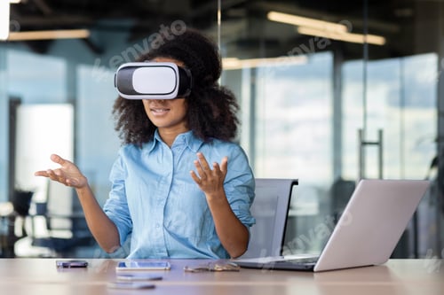 Preview: Businesswoman at workplace wearing virtual reality glasses communicating remotely in video