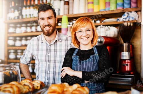 Friendly Owners Smiling in Local Bakery