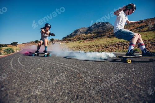 Preview: Teenagers longboarding on open road