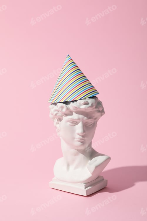 Preview: Happy birthday concept with ancient head on pink background
