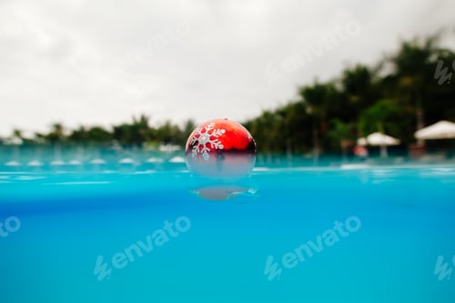 Preview: christmas decoration in blue water in tropics. tropical christmas