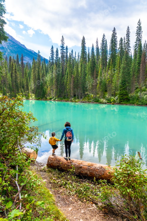 Preview: Tourists admiring emerald lake in banff national park, alberta