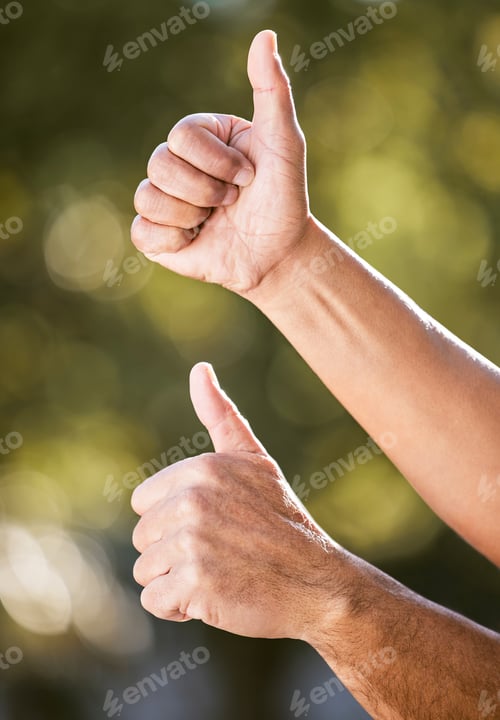 Preview: Youve got my stamp of approval. Shot of two unrecognisable men showing thumbs up outdoors.
