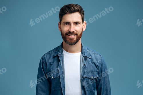 Preview: Portrait of cheerful handsome man in denim shirt smiling to the camera
