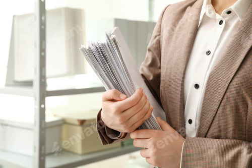 Preview: Female worker with documents in archive, closeup. Space for text