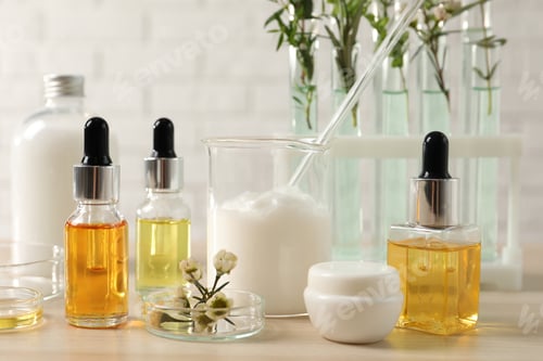 Preview: Organic cosmetic products, natural ingredients and laboratory glassware on wooden table, closeup