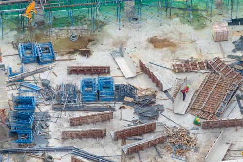 Preview: Busy industrial under construction site workers working and excavators. Top view of precast concrete
