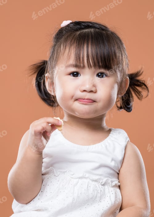 Preview: Baby girl eating snack