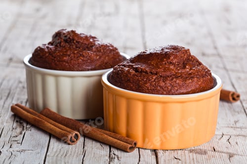 Preview: two fresh baked browny cakes and cinnamon sticks