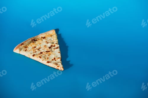 Preview: close up view of piece of italian pizza isolated on blue