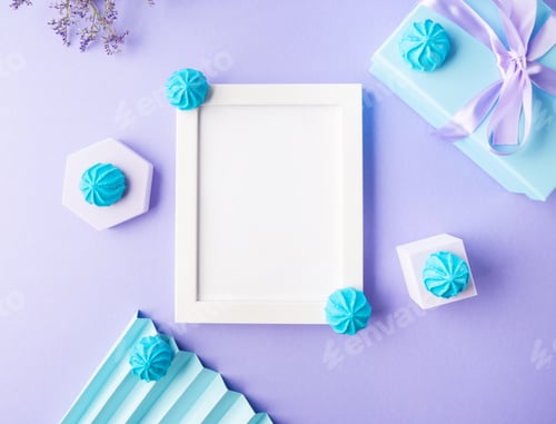 Preview: White empty frame on purple background with blue sweet decor