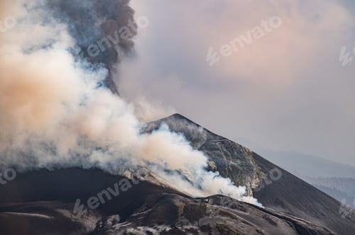 Preview: Thick smoke covering active volcano against cloudy sky