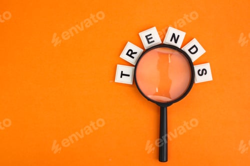 Preview: magnifying glass and letters of the alphabet with the word trends.