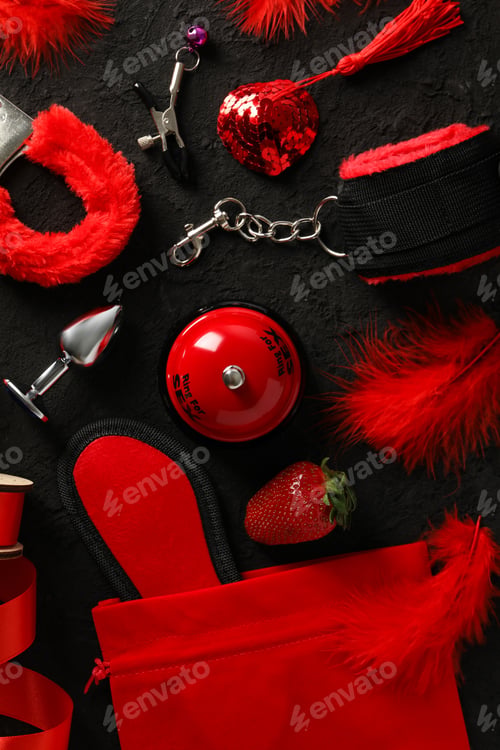 Preview: A collection of sex toys on a dark background.