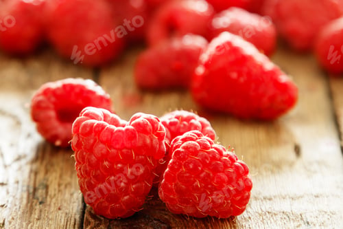 Preview: Fresh red raspberries on the wooden table