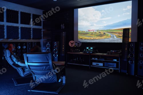 Preview: Couple watching movie together on big screen in home cinema