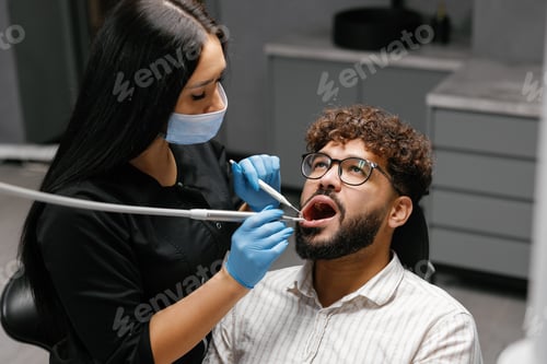 Preview: Man Receiving Dental Check Up From Dentist