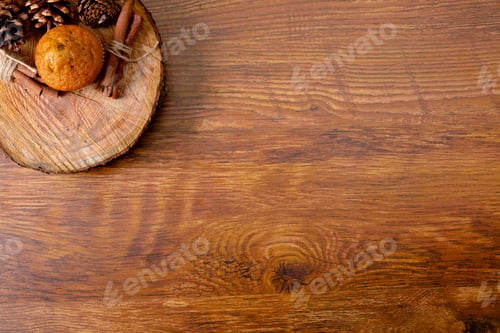 Preview: Composition of christmas decorations with orange, cinnamon and copy space on wooden background