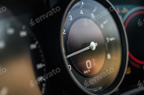 Preview: Speedometer and Dashboard Display in a Luxury Car Interior During Daylight