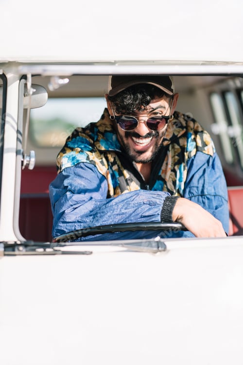 Preview: Driver of retro van looking at camera