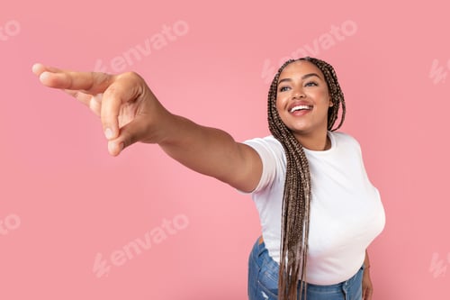 Preview: Black Plus Size Female Giving Invisible Object Over Pink Background