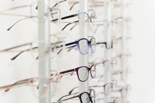 Preview: Row of luxury eyeglass at an opticians store.
