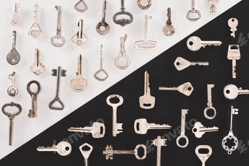 Preview: top view of different vintage keys over black and white background