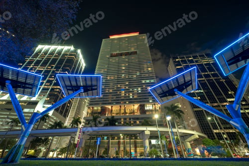 Preview: Blue solar photovoltaic panels mounted in modern city on street poles for electricity supply