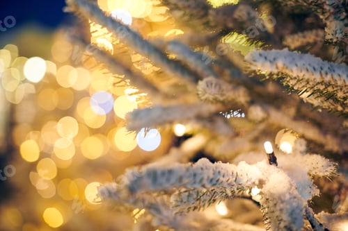Preview: Christmas tree with yellow garlands lights and bokeh copy space with sparkled bokeh, Christmas time