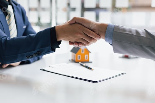 Preview: Businessman handshake after reaching a real estate deal.