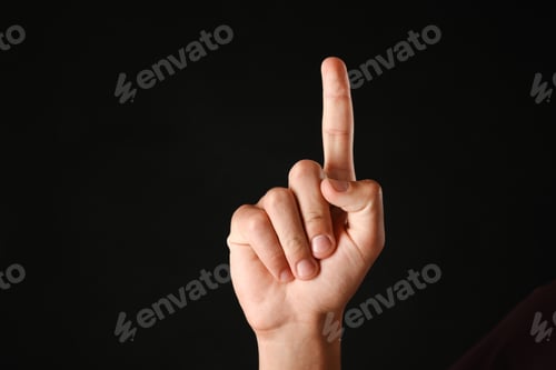 Preview: Man touching something on black background, closeup