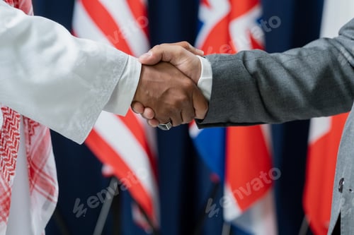 Preview: Two contemporary male delegates or political leaders shaking hands