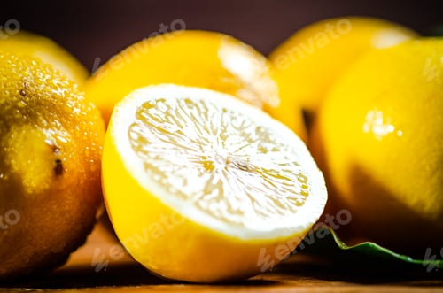 Preview: Fresh lemons. On wooden table.