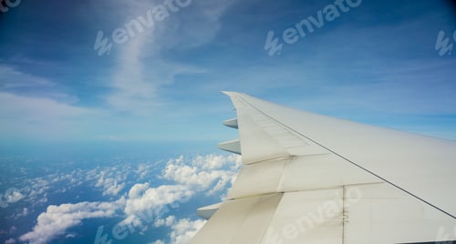Preview: Air plane wing with blue sky