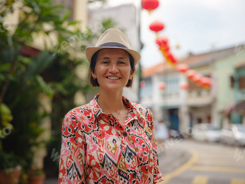 Preview: woman exploring streets of George Town, during Chinese New Year.