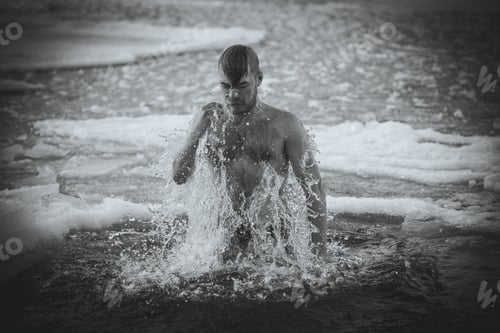 Preview: A Young Boy Is Bathed In The Icy Water. The Christian Holiday Of Epiphany.
