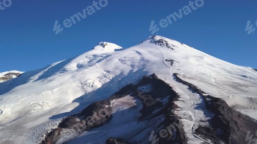 Preview: Snowy and icy mountain peaks of glaciers in Austrian Alps at winter. Clip. Aerial view of a snowy