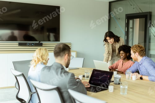 Preview: Diverse team engaging in strategic planning during bright daytime office meeting