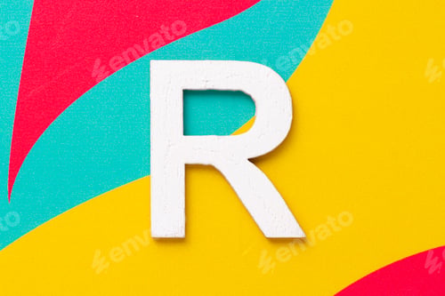 Preview: Letter R of the alphabet on colored background, top view