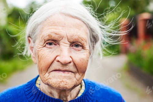 Preview: Portrait of an aged woman outdoors