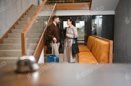 Preview: Couple on a business trip doing check-in at the hotel