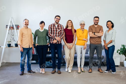 Preview: Happy Diverse Team Smiling Together in a Bright Modern Office Setting