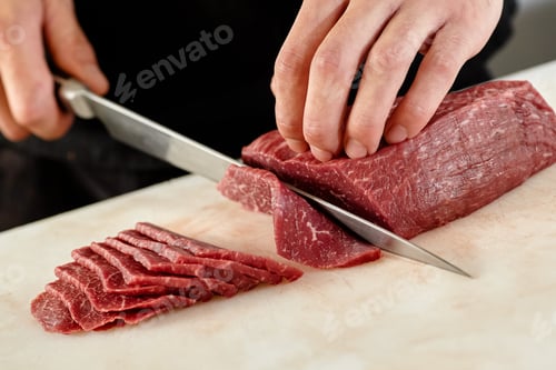 Preview: Japanese man slicing meat