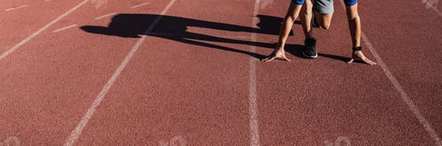 Preview: Man getting ready to take off on the running track