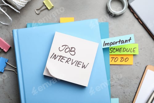 Preview: Reminder note about job interview and stationery on table, flat lay